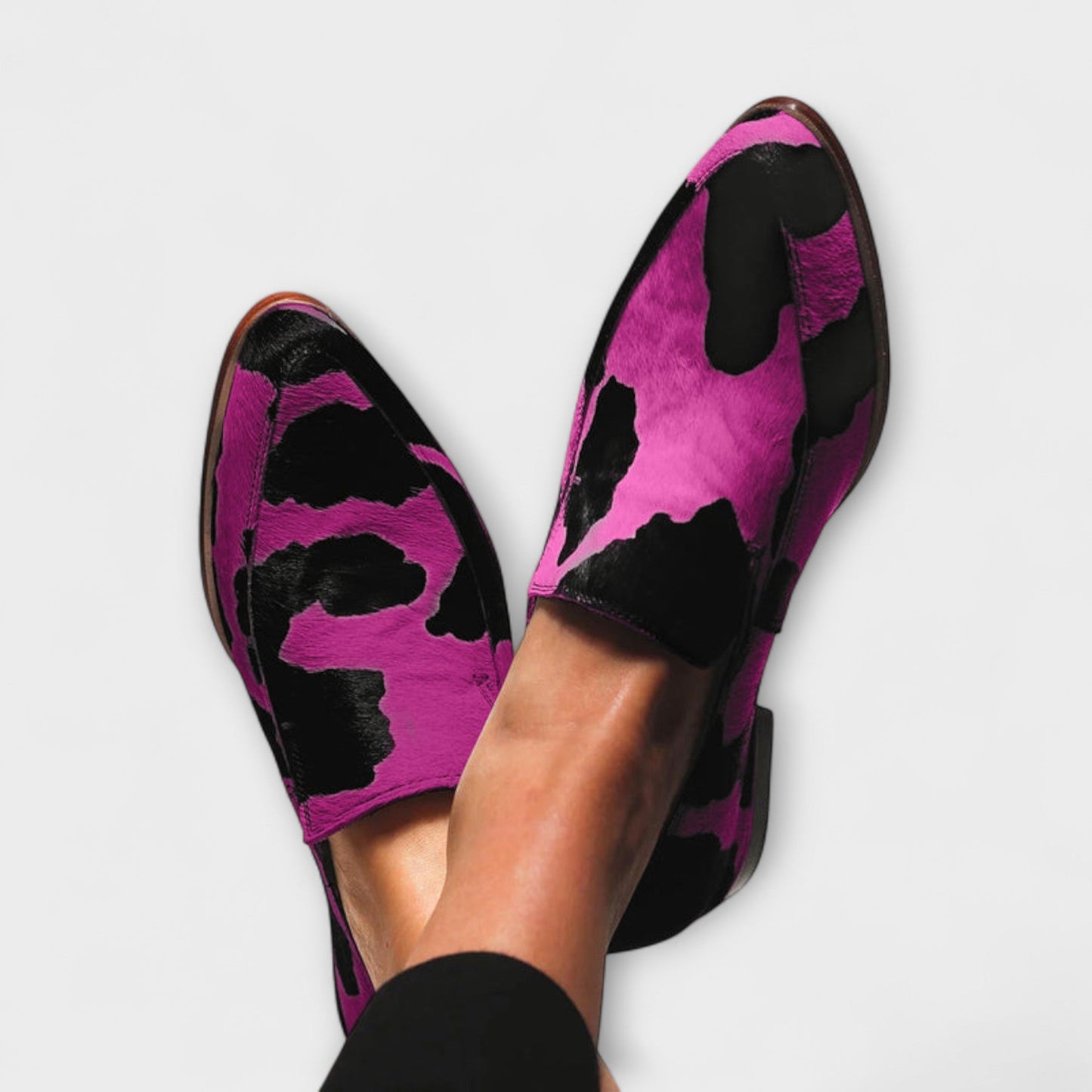 Paloma Women’s loafers featuring a stylish cow print design and elegant pointed toe, perfect for a chic and trendy look. 0