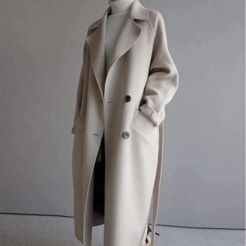 Penelope Women’s Longline Coat featuring premium wool fabric, elegant button closures, and a stylish silhouette, perfect for cold weather and fashionable layering. 0