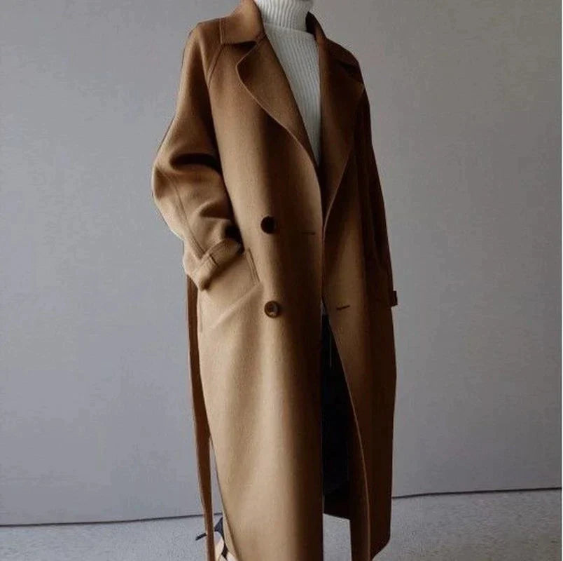 Penelope Women’s Longline Coat featuring premium wool fabric, elegant button closures, and a stylish silhouette, perfect for cold weather and fashionable layering. 1