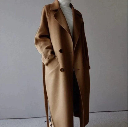 Penelope Women’s Longline Coat featuring premium wool fabric, elegant button closures, and a stylish silhouette, perfect for cold weather and fashionable layering. 1