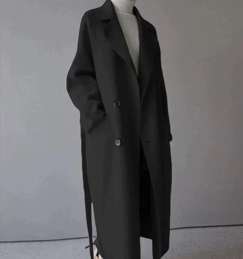 Penelope Women’s Longline Coat featuring premium wool fabric, elegant button closures, and a stylish silhouette, perfect for cold weather and fashionable layering. 2