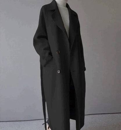 Penelope Women’s Longline Coat featuring premium wool fabric, elegant button closures, and a stylish silhouette, perfect for cold weather and fashionable layering. 2