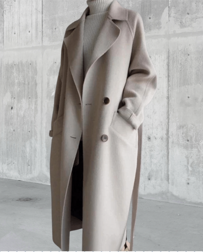 Penelope Women’s Longline Coat featuring premium wool fabric, elegant button closures, and a stylish silhouette, perfect for cold weather and fashionable layering. 3
