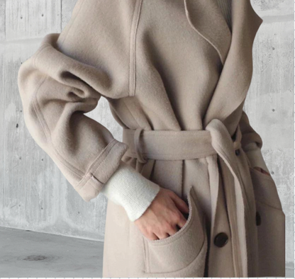 Penelope Women’s Longline Coat featuring premium wool fabric, elegant button closures, and a stylish silhouette, perfect for cold weather and fashionable layering. 4