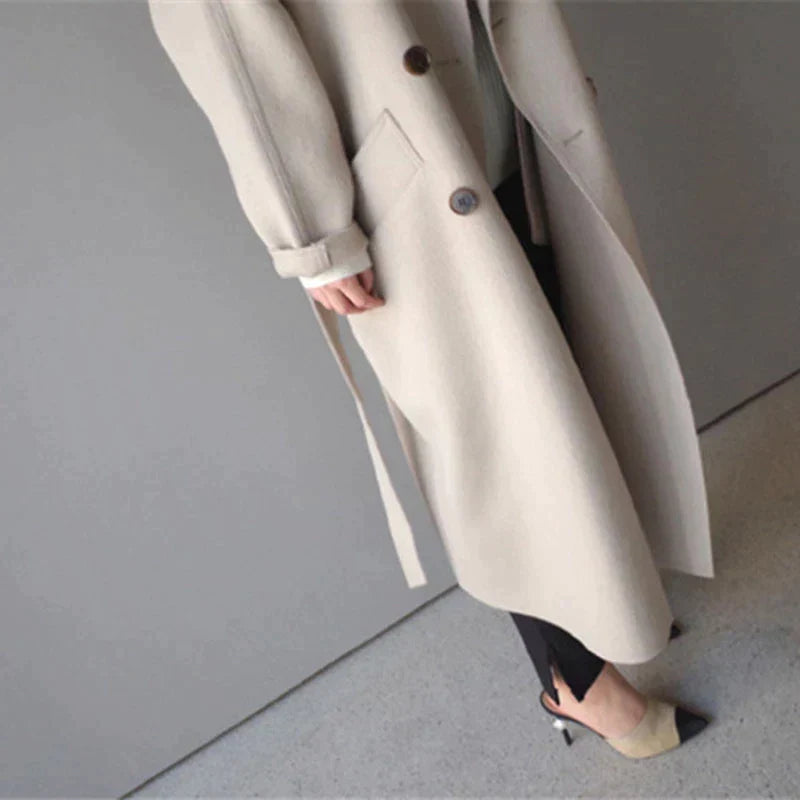 Penelope Women’s Longline Coat featuring premium wool fabric, elegant button closures, and a stylish silhouette, perfect for cold weather and fashionable layering. 5