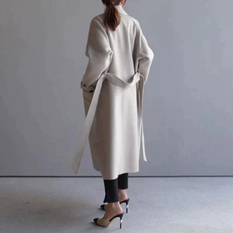 Penelope Women’s Longline Coat featuring premium wool fabric, elegant button closures, and a stylish silhouette, perfect for cold weather and fashionable layering. 6