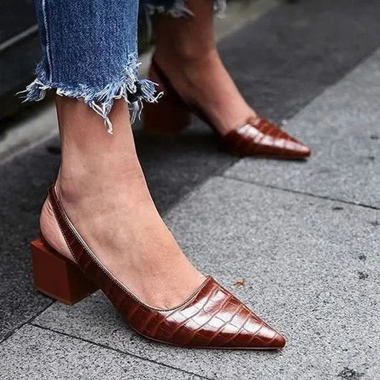 Pura Women's Pumps featuring a stylish pointed toe and an adjustable slingback strap, perfect for elegant occasions and comfortable wear. 0