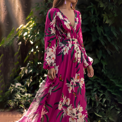 Raya Women’s Dress featuring a flowy fit and vibrant floral design, perfect for stylish summer wear. 1