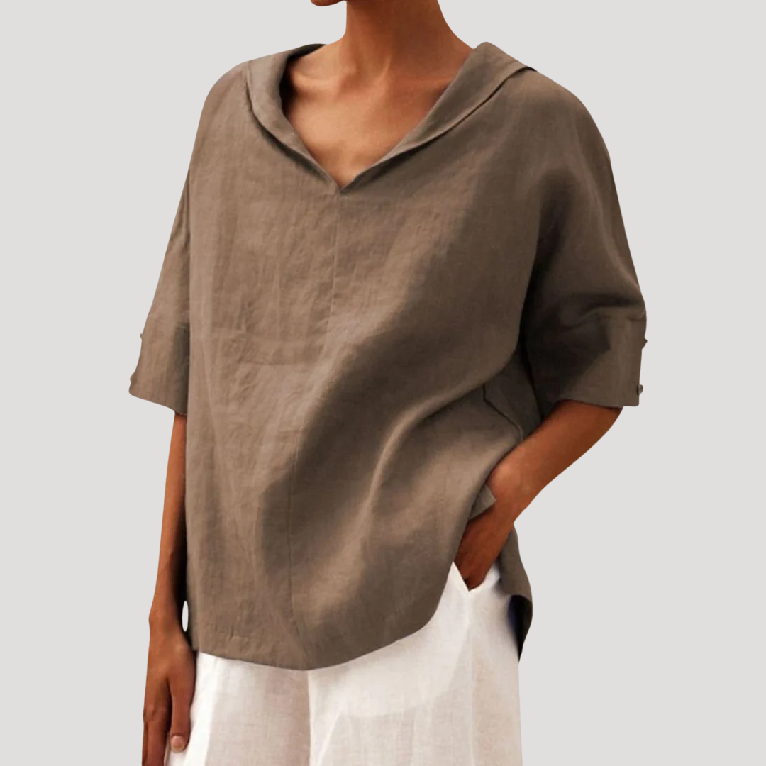 Rela Women's blouse featuring a stylish notch neckline and elegant three-quarter sleeves, perfect for casual and professional wear. 4