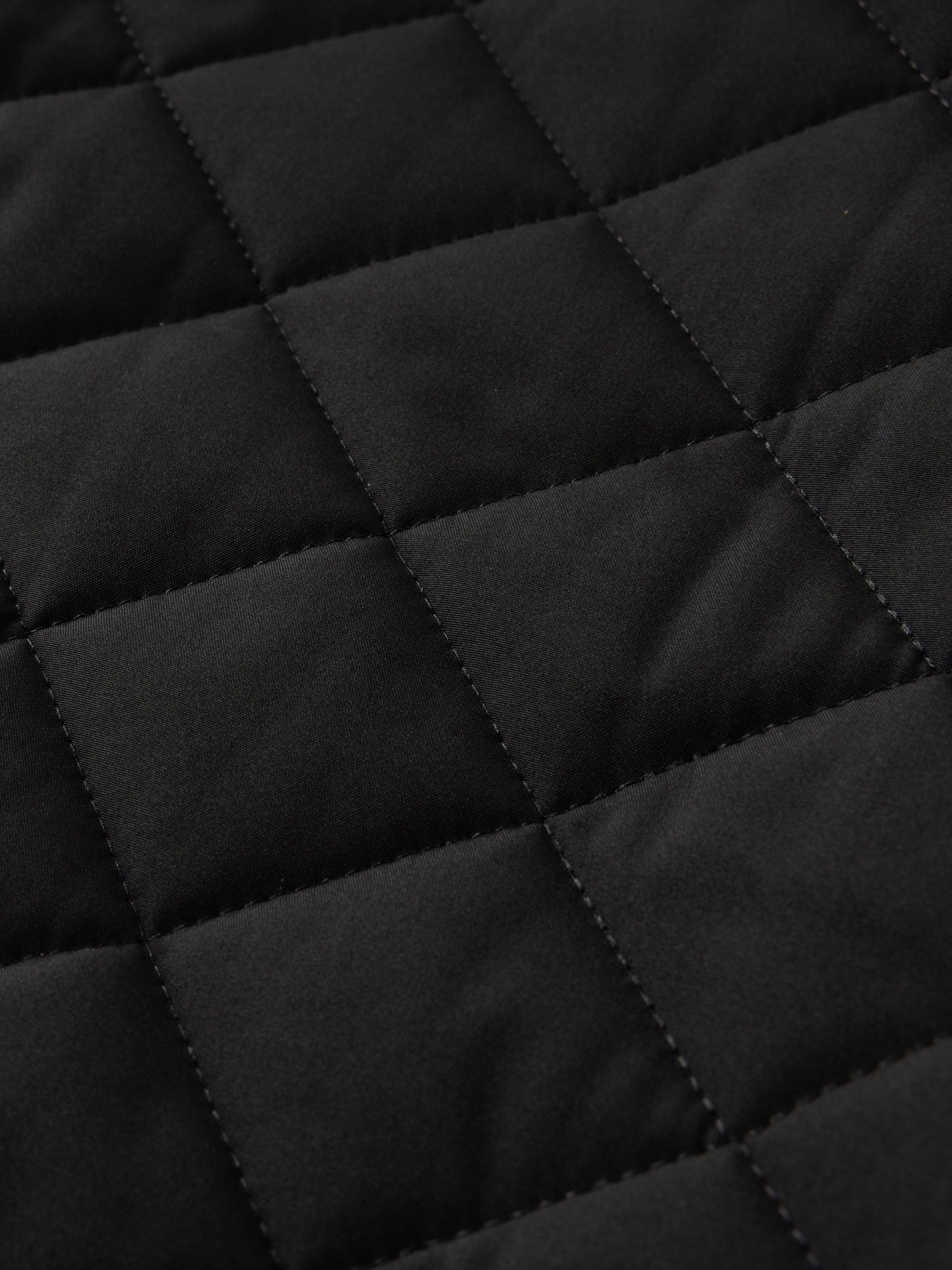 Reuben Men's Quilted Bomber Jacket featuring warm plush lining and a classic design, perfect for stylish comfort in cold weather. 4