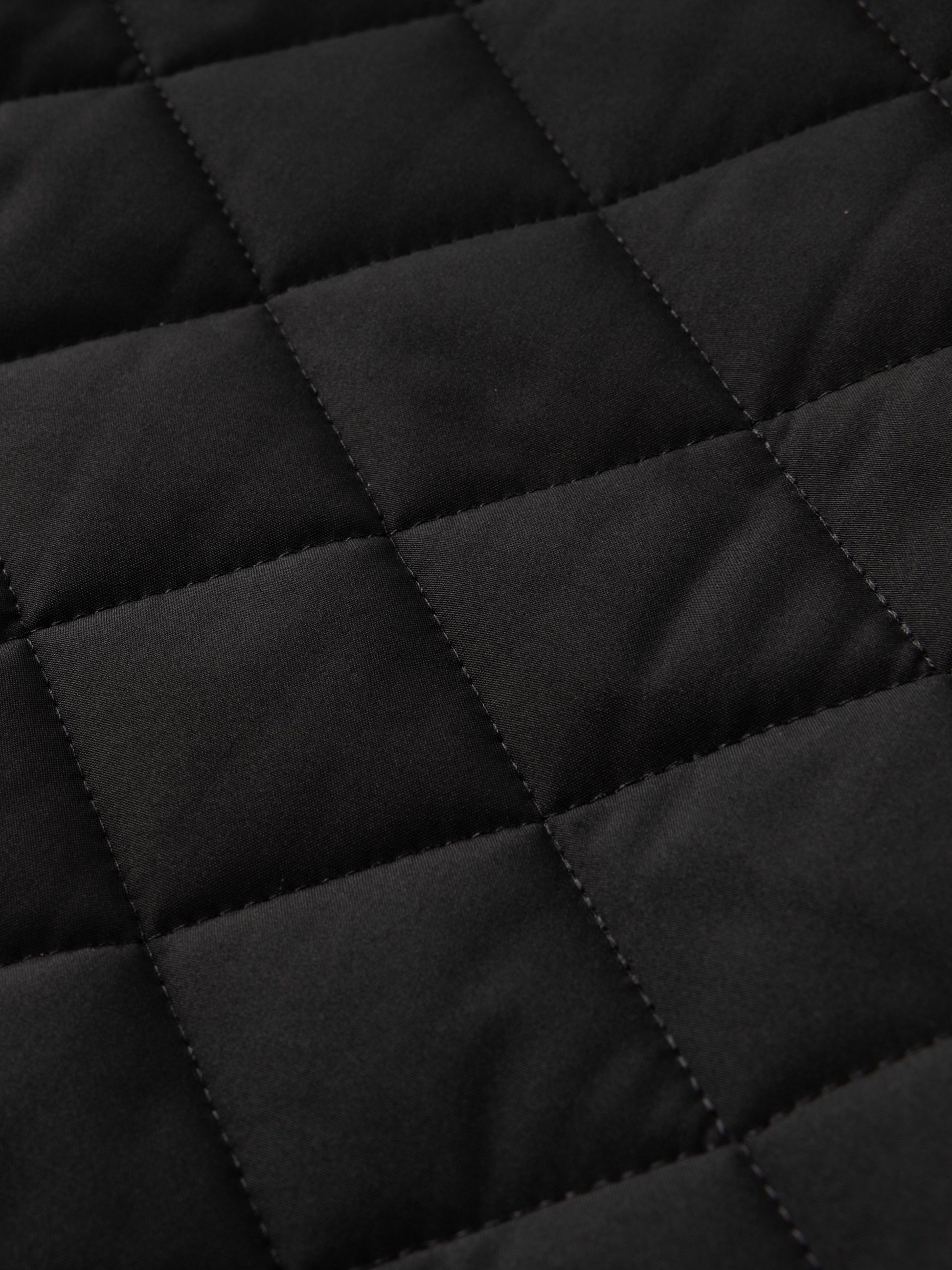 Reuben Men's Quilted Bomber Jacket featuring warm plush lining and a classic design, perfect for stylish comfort in cold weather. 4