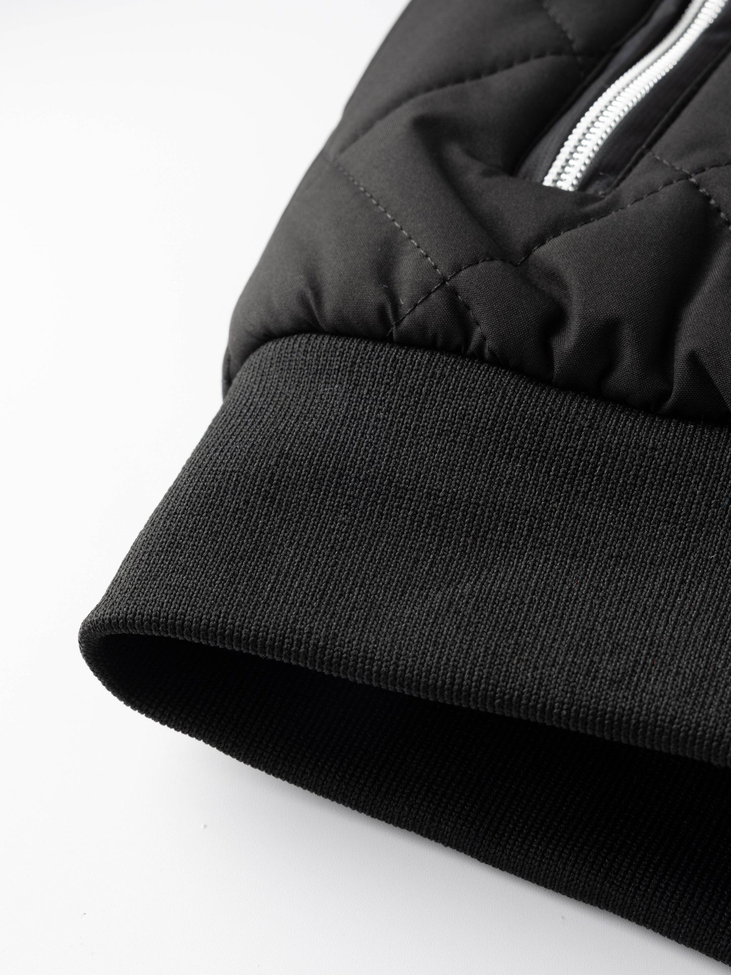Reuben Men's Quilted Bomber Jacket featuring warm plush lining and a classic design, perfect for stylish comfort in cold weather. 7