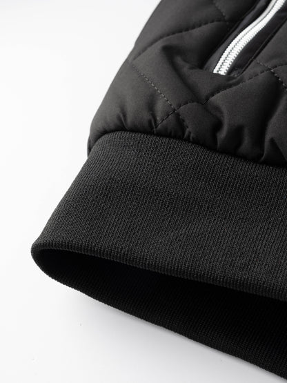 Reuben Men's Quilted Bomber Jacket featuring warm plush lining and a classic design, perfect for stylish comfort in cold weather. 7
