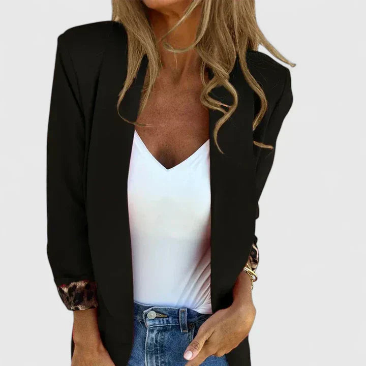 Rosavionne Women’s Blazer featuring a tailored silhouette and reversible leopard lining, perfect for stylish versatility and sophisticated fashion. 0
