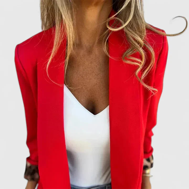 Rosavionne Women’s Blazer featuring a tailored silhouette and reversible leopard lining, perfect for stylish versatility and sophisticated fashion. 1