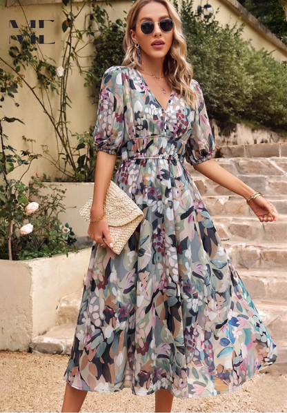 Roxy Women’s Midi Dress featuring a vibrant floral print and stylish puff sleeves, perfect for summer outings and casual gatherings. 0