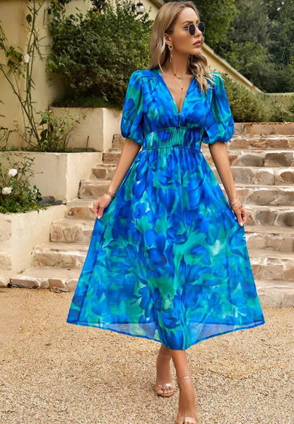 Roxy Women’s Midi Dress featuring a vibrant floral print and stylish puff sleeves, perfect for summer outings and casual gatherings. 2