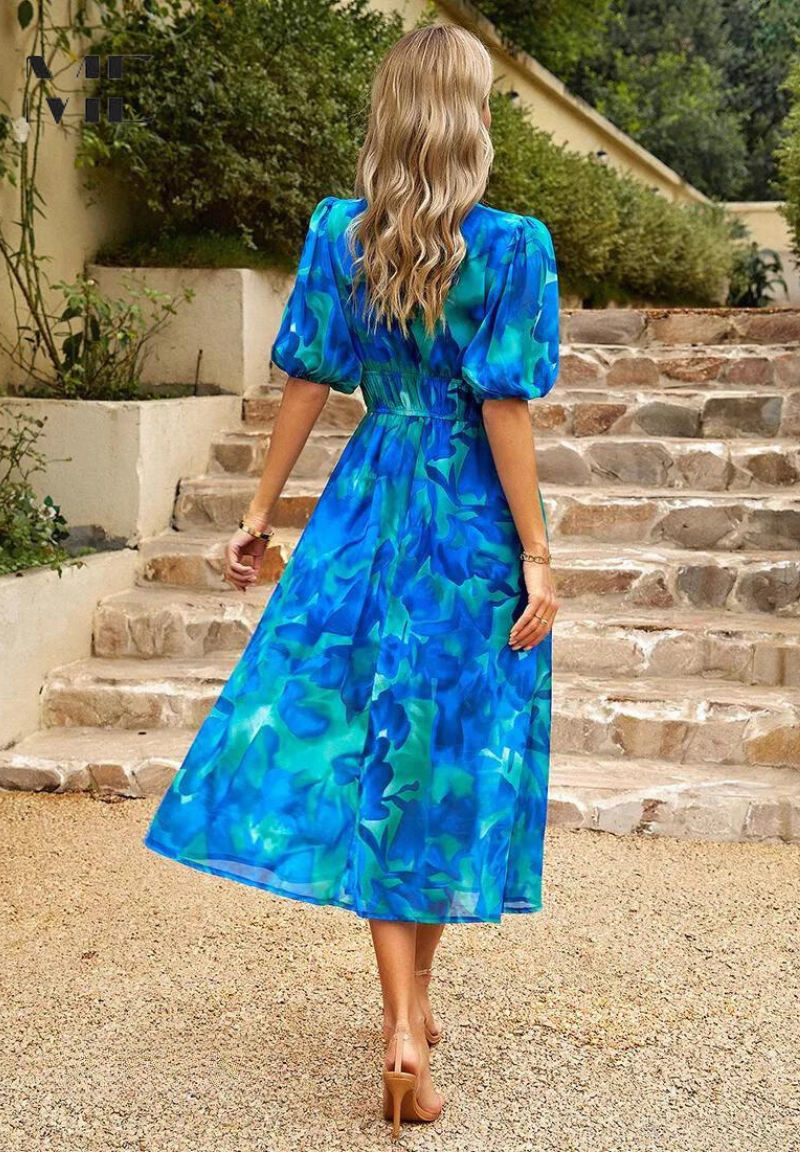 Roxy Women’s Midi Dress featuring a vibrant floral print and stylish puff sleeves, perfect for summer outings and casual gatherings. 3
