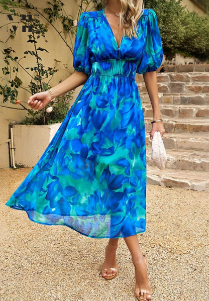 Roxy Women’s Midi Dress featuring a vibrant floral print and stylish puff sleeves, perfect for summer outings and casual gatherings. 5