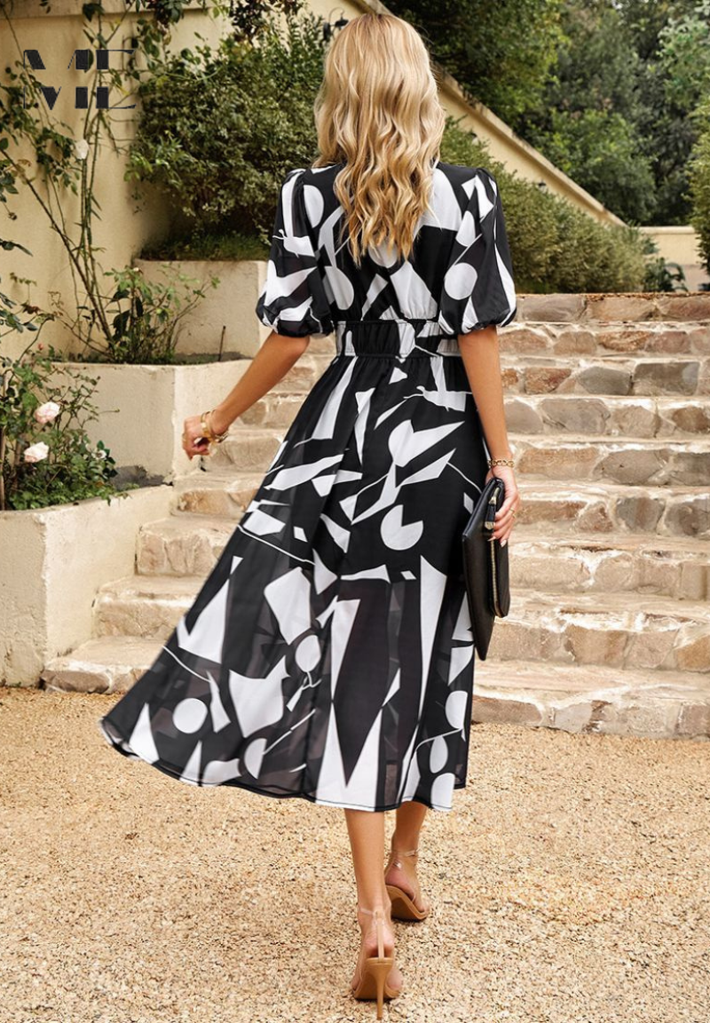 Roxy Women’s Midi Dress featuring a vibrant floral print and stylish puff sleeves, perfect for summer outings and casual gatherings. 8