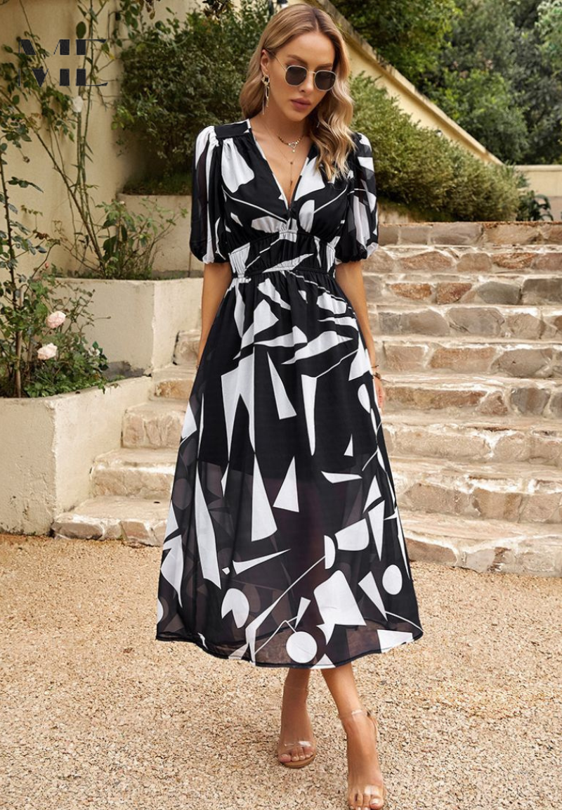 Roxy Women’s Midi Dress featuring a vibrant floral print and stylish puff sleeves, perfect for summer outings and casual gatherings. 9