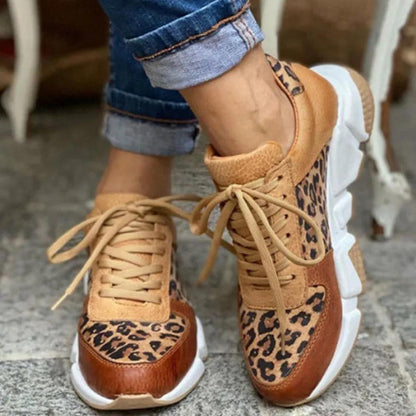 Sassy women’s sneakers featuring a bold animal print design and stylish lace-up closure for a trendy look. 0