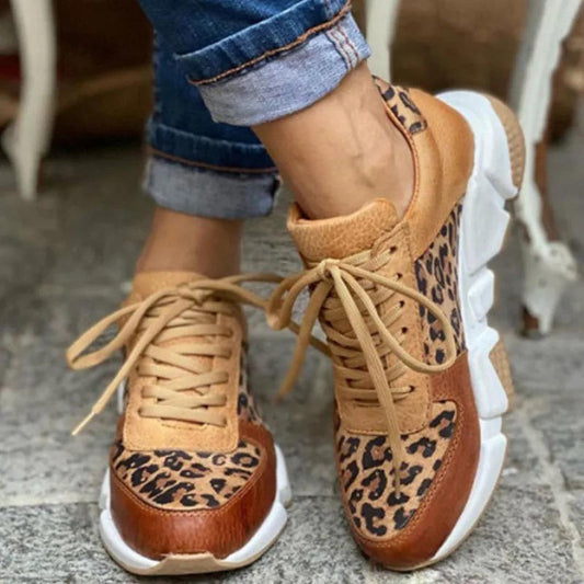 Sassy women’s sneakers featuring a bold animal print design and stylish lace-up closure for a trendy look. 0