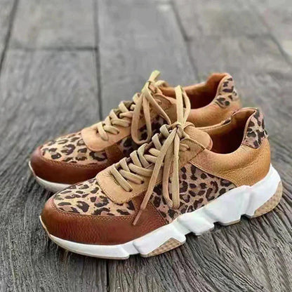 Sassy women’s sneakers featuring a bold animal print design and stylish lace-up closure for a trendy look. 1