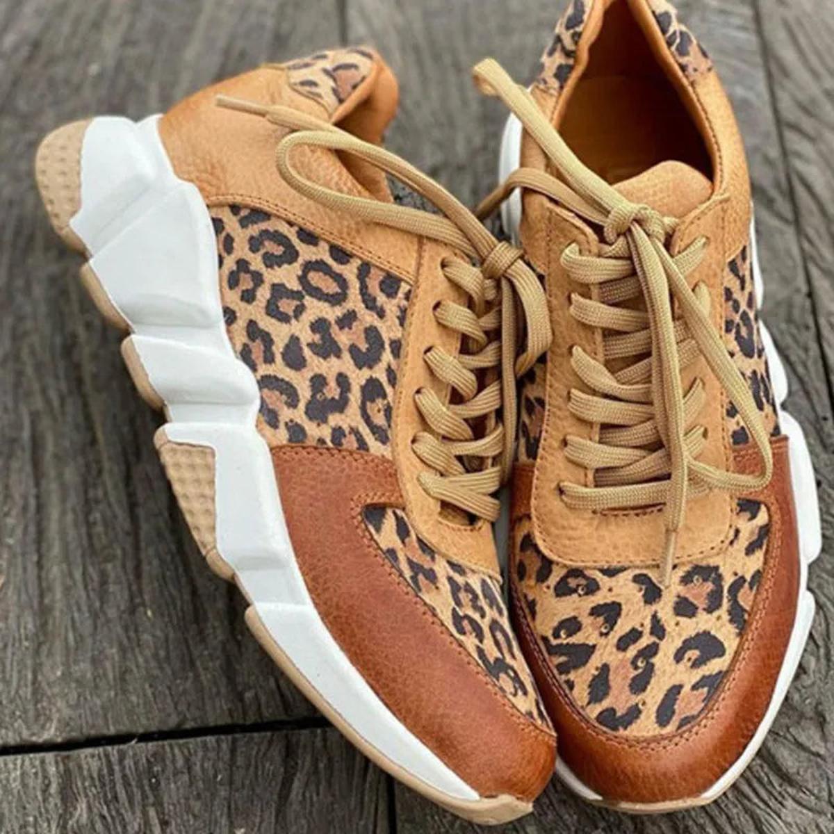 Sassy women’s sneakers featuring a bold animal print design and stylish lace-up closure for a trendy look. 2