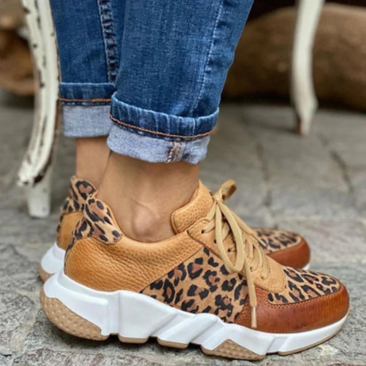 Sassy women’s sneakers featuring a bold animal print design and stylish lace-up closure for a trendy look. 3