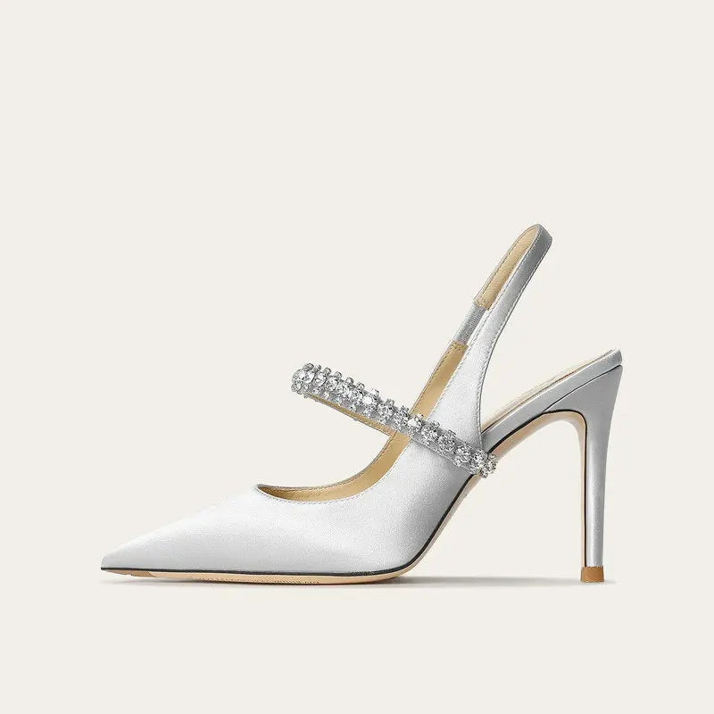 Satinia women's heels featuring a pointed toe design and an elegant jewelled ankle strap, perfect for formal occasions and stylish outfits. 0