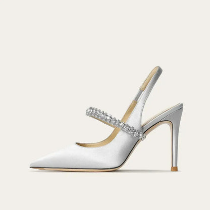Satinia women's heels featuring a pointed toe design and an elegant jewelled ankle strap, perfect for formal occasions and stylish outfits. 0