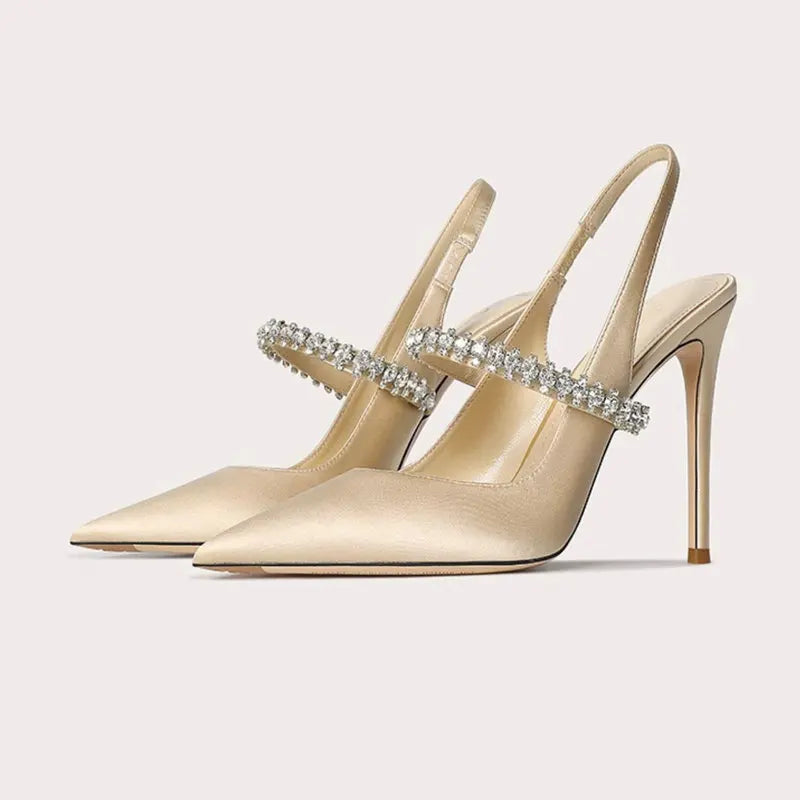 Satinia women's heels featuring a pointed toe design and an elegant jewelled ankle strap, perfect for formal occasions and stylish outfits. 1