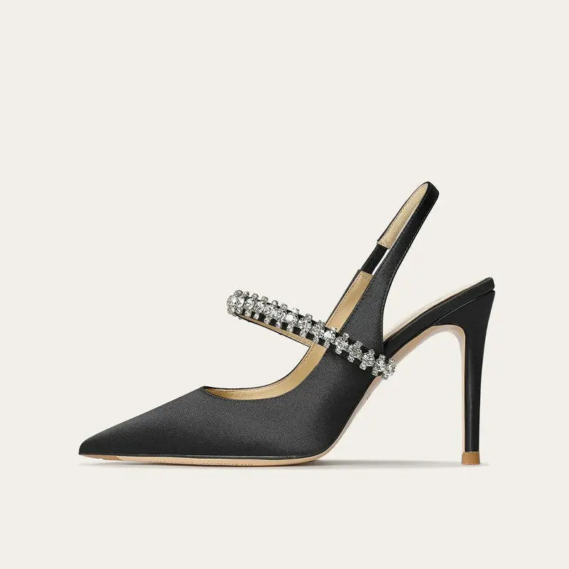 Satinia women's heels featuring a pointed toe design and an elegant jewelled ankle strap, perfect for formal occasions and stylish outfits. 2