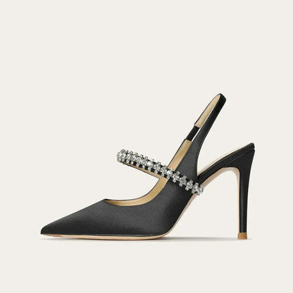 Satinia women's heels featuring a pointed toe design and an elegant jewelled ankle strap, perfect for formal occasions and stylish outfits. 2