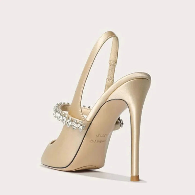 Satinia women's heels featuring a pointed toe design and an elegant jewelled ankle strap, perfect for formal occasions and stylish outfits. 4