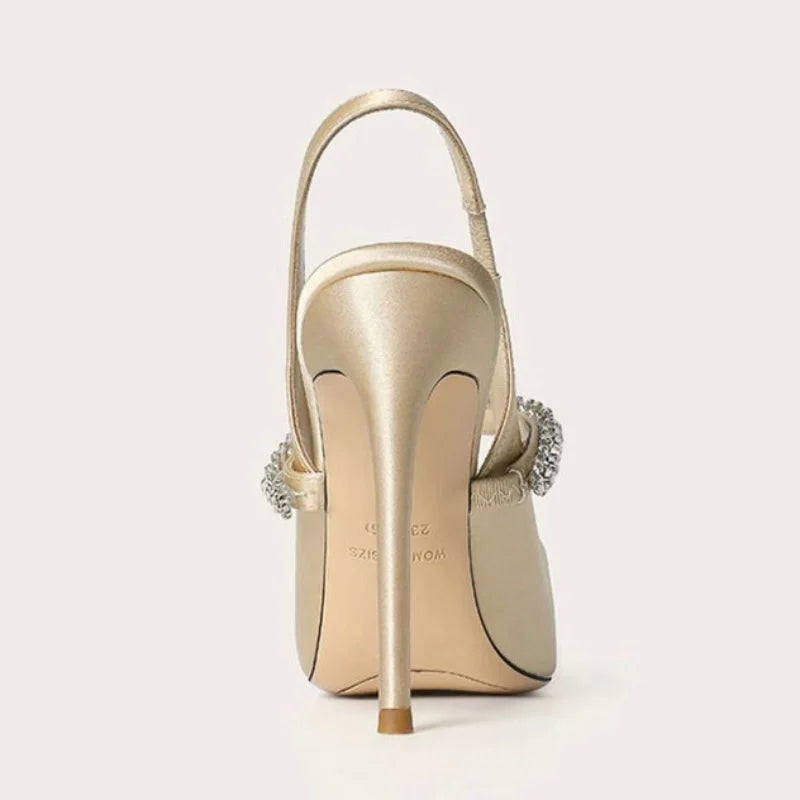 Satinia women's heels featuring a pointed toe design and an elegant jewelled ankle strap, perfect for formal occasions and stylish outfits. 5