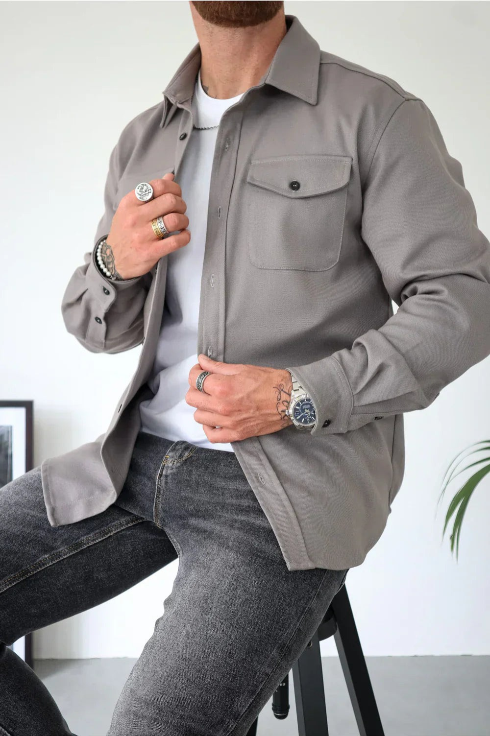 Sleek men's shirt jacket featuring a stylish button-up design and a convenient chest pocket, perfect for casual or semi-formal occasions. 0