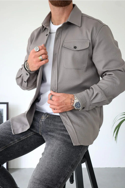 Sleek men's shirt jacket featuring a stylish button-up design and a convenient chest pocket, perfect for casual or semi-formal occasions. 0