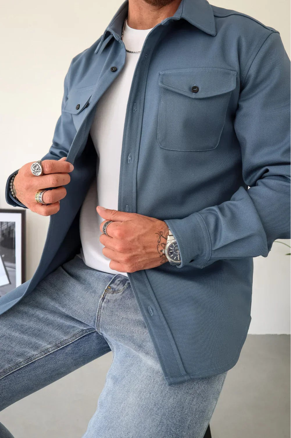 Sleek men's shirt jacket featuring a stylish button-up design and a convenient chest pocket, perfect for casual or semi-formal occasions. 10