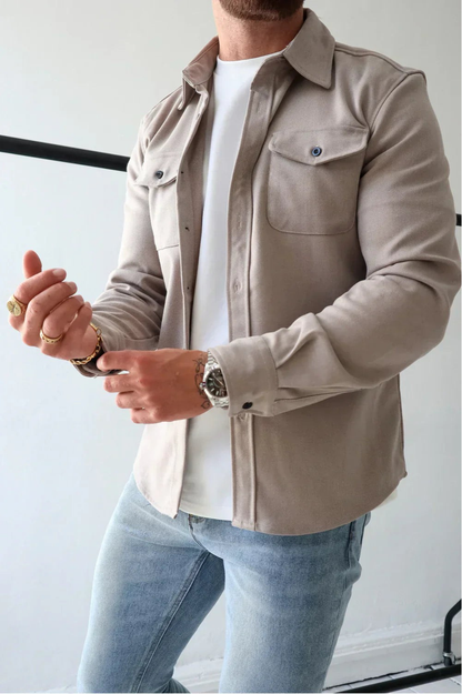 Sleek men's shirt jacket featuring a stylish button-up design and a convenient chest pocket, perfect for casual or semi-formal occasions. 11