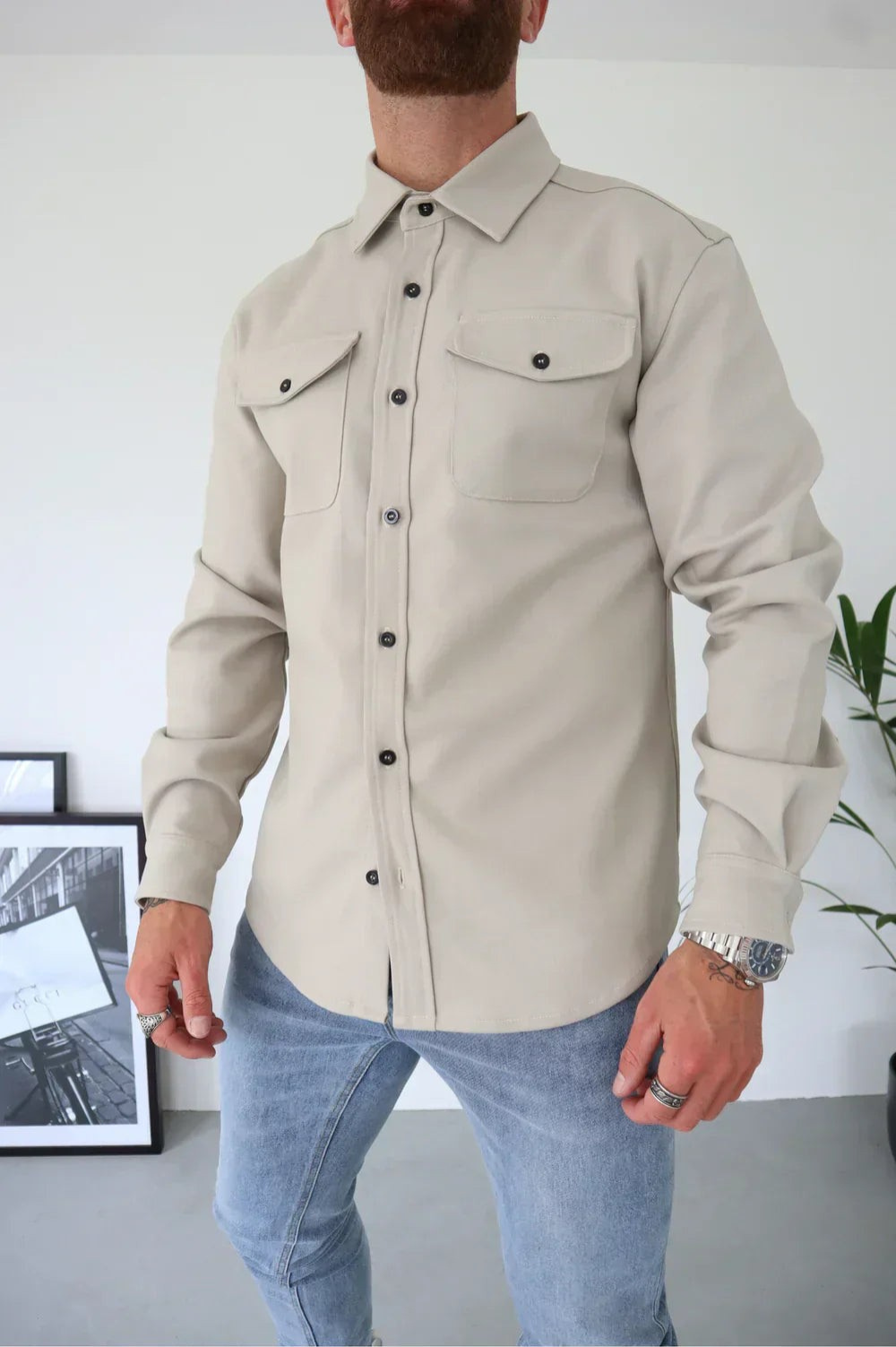 Sleek men's shirt jacket featuring a stylish button-up design and a convenient chest pocket, perfect for casual or semi-formal occasions. 8