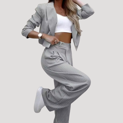Sleek suit set for women featuring a stylish cropped blazer and wide-leg trousers, designed for a modern and sophisticated look. 4