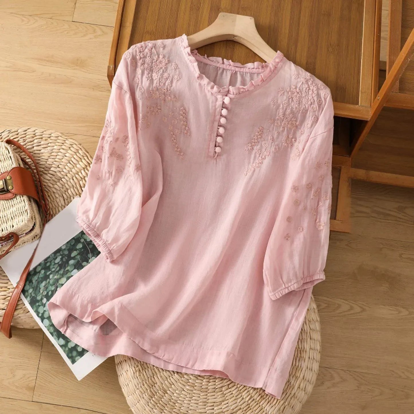 Sleek women's blouse featuring delicate floral embroidery and a stylish button-front design, perfect for both casual and formal occasions. 2