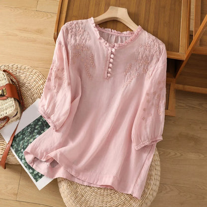 Sleek women's blouse featuring delicate floral embroidery and a stylish button-front design, perfect for both casual and formal occasions. 2