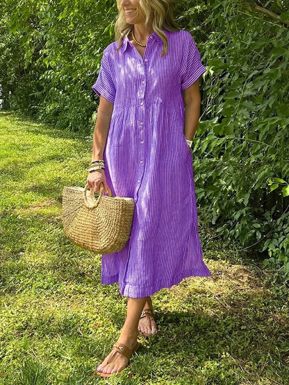 Sleek women’s dress featuring a stylish button-up front and a chic vertical stripe design, perfect for both casual and formal occasions. 6