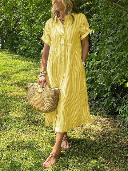Sleek women’s dress featuring a stylish button-up front and a chic vertical stripe design, perfect for both casual and formal occasions. 7