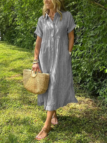 Sleek women’s dress featuring a stylish button-up front and a chic vertical stripe design, perfect for both casual and formal occasions. 9