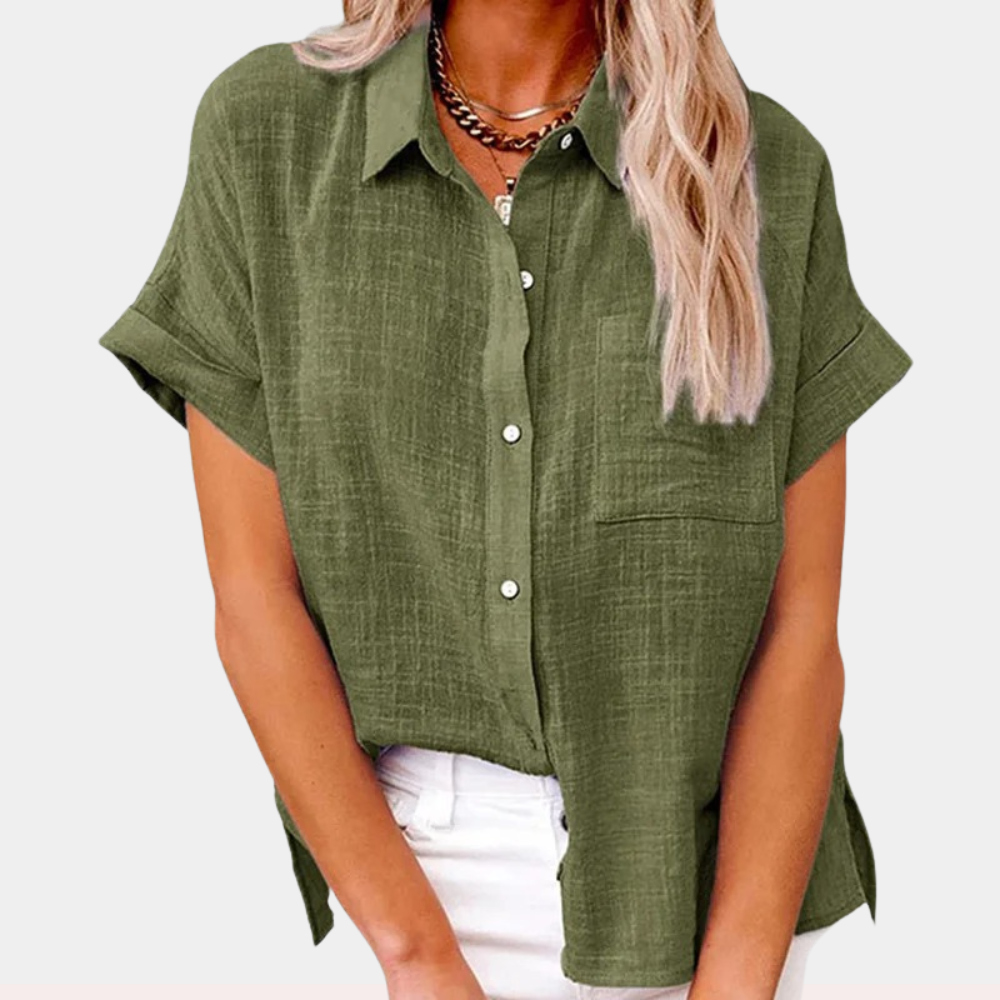 Sleek women's shirt featuring a stylish collared neckline and a practical front pocket, perfect for both casual and professional looks. 1