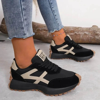Sleek women's sneakers featuring a stylish lace-up design and orthopedic support for comfort and stability. 0